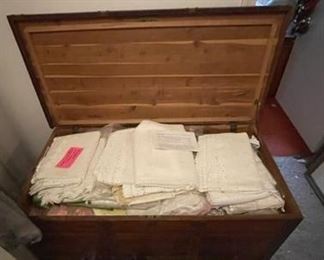 Antique trunk with linens.
