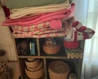 Quilts and baskets.