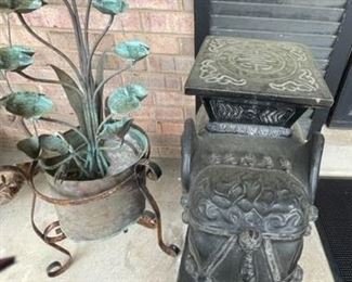 Three black elephant plant stands.