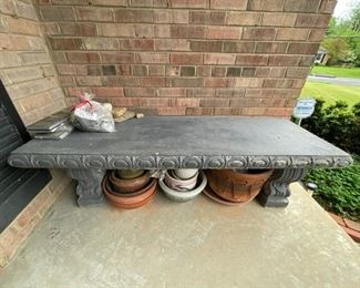 Concrete bench and pots.