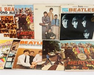 1017 LOT OF 9 VINYL BEATLES ALBUMS INCLUDES MOSTLY 1970'S RELEASES W/APPLE LABELS, SGT PEPPERS, SOMETHING NEW, THE BEATLES VI, MAGICAL MYSTERY TOUR, ABBEY ROAD, THE BEATLES YESTERDAY & TODAY, MEET THE BEATLES & THE BEATLES SECOND ALBUM, SOME RECORDS MISSING SLEEVES, COVERS SHOW SIGNS OF WEAR SUCH AS STAINING, SPLITS, ETC