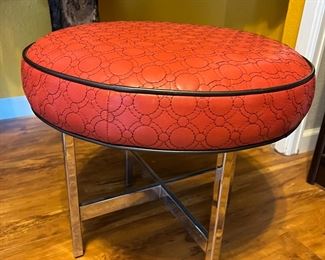 red vinyl and chrome ottoman