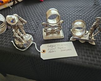 There are 8 antique napkin rings plus tooth pick holder and other items