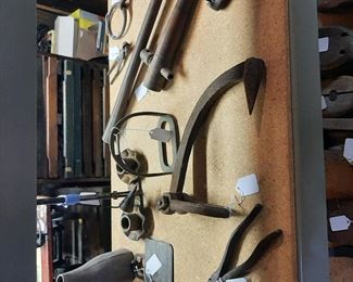 Log Dogs, Leather Dice Cup, Shingle Hammer, End of a Pike Pole, Stirrup