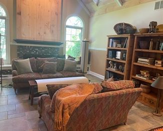 POTTERY BARN BOOK SHELVES FILLED WITH DECORATIVES AND ART BOOKS