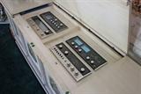 High-end vintage McIntosh audio components, with all original paperwork, built in to a custom fabricated stereo cabinet. (91” x 21”)