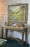 A finely detailed Grecian Romanesque console table with a white marble top. (54” long)