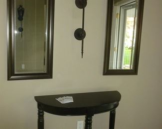 1/2 round table & 2 beveled mirrors (light in the center stays with the house)