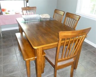 Nice table w/4 padded chairs & bench