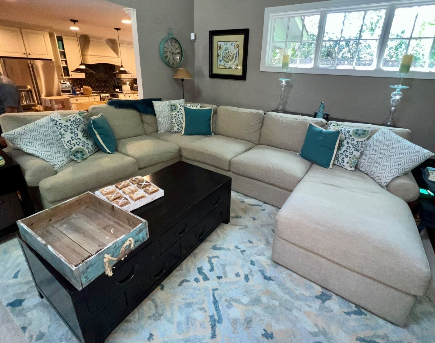 Bassett furniture sectional; pillows; Pottery Barn coffee table; pillows; various decor