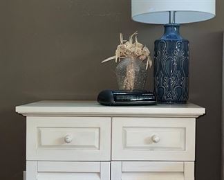 Cabinet; ceramic lamp; clock and vase
