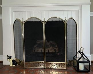 Brass fire screen; vintage cast iron doorstop; candle holder