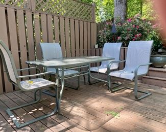 Patio glass top table and 4 armchairs