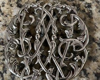 silver tone trivet