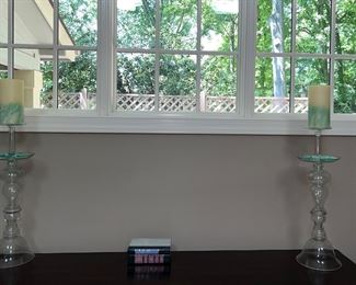 Glass candle holders; books