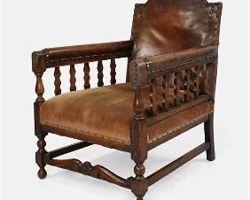 English Regency Carved Chestnut and Leather Lolling Library Armchair
