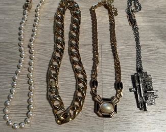 3 on Left DIOR  (Dior sold) and pewter brutalist is  Robert Larin 