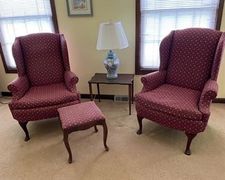 Upholstered wingback chairs and matching ottoman