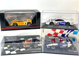 1968 McLaren M8A, 1997 McLaren-BMW F1 GTR, 2002 Williams-BMW FW24, and 2010 Red Bull Racing RB6 Championship Winning Car MiniChamps 1:43 Model Cars

