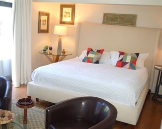 Pair of black leather club chairs 