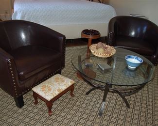Club chairs and glass coffee table
