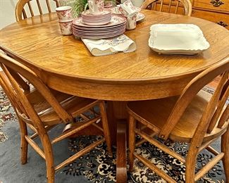 1st of (2) Oak Pedestal Table w/4 Chairs Nice finish, shown w/leaf in…can go down to a small round Table