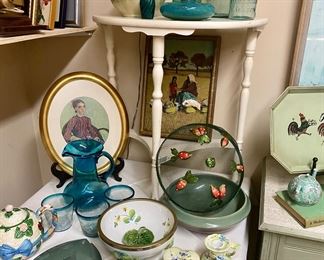 The client did remove the small batik painting of the mother and Child pictured under the white table. Very sorry 