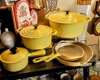 1960's Le Creuset in Élysée Yellow. P14 saucepan, 'B' 2 quart Dutch oven, 'E' 4.5 quart Dutch oven, 6.5 inch skillet, 9 inch skillet.