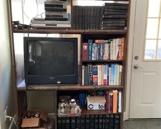 Wooden book shelves with tons of vintage books, stereo equipment and more!