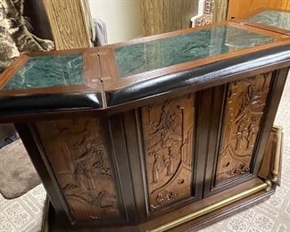 Dry bar completely open. Green marble top and brass foot rail. 