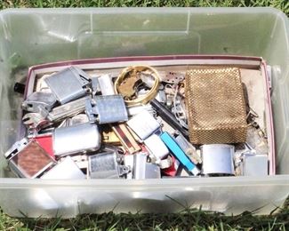 384 - Lot of Assorted Lighters, Parts, and Pieces
