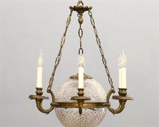 A mid 20th century chandelier.  Six curved Brass arms around a cut Crystal sphere.  Minor wear, re-wired.  24" diameter x 34" high overall.  