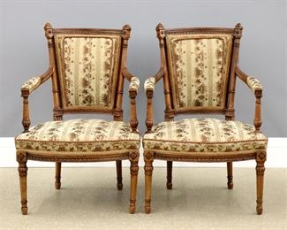 A pair of Louis XVI Period French Fauteuils by Bosson, Paris.  Fruitwood construction with upholstered backs, arm rests and seats, shaped top rails with carved moldings and finials, turned fluted back posts and shaped arms with turned supports, shaped seats supported by turned legs with carved floral blocks and foliate detail.  Each stamped with maker's name "BOSSON" at underside of rear seat rails. Restored finish and nicely reupholstered.  Each 24 x 21 x 35 1/2"   high overall.  ESTIMATE $2,000-3,000  NOTE: Bosson is recorded by Pierre Kjellberg in "Le Mobilier Francais du XVIIIe siècle" Paris, 1998, p. 84