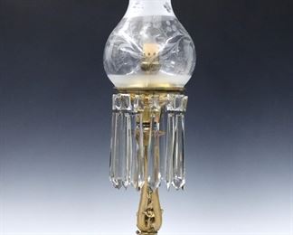 A 19th century American Astral lamp.  Brass font and Gilt Bronze stem with floral design on a stepped marble base, with an etched glass shade and pressed glass prisms.  Electrified, repaired break to Marble corner, some prisms replaced with small chips.  26" high overall.  