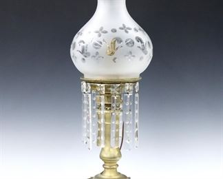A 19th century American Astral lamp.  Brass font and stem on a squared base, with a frosted glass shade and pressed glass prisms.  Electrified with burner removed, large chip to shade fitter for cord, some prisms replaced with minor flakes.  23 1/2" high overall.  ESTIMATE $200-300
