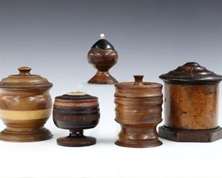 Five 19th to early 20th century turned wooden boxes with lift-off covers.  Includes three American treenware boxes and two Mexican boxes with inlaid bone and etched detail.  Wear, some shrinkage and losses.  Up to 5 1/2" high.  
