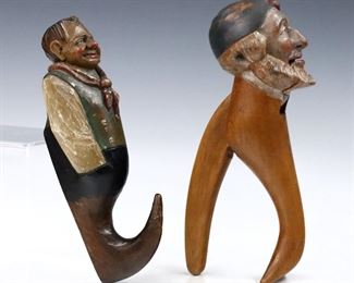 Two 19th century German Black Forest figural carvings.  Includes a nutcracker and wall hook with polychrome detail.  Some wear to surface and painted detail.  Up to 8" high. 
