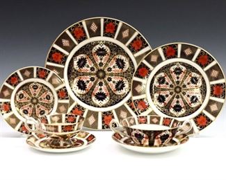 A 20th century Royal Crown Derby "Old Imari" pattern fine bone china dinner service set.  Features 8 five-piece place settings.  Includes 8 x 10 1/2" dinner plates, 8 x 8 1/2" salad plates, 8 x 6 1/4" bread plates, 8 x 7" soups with saucers, and 8 x 5" teacups with saucers.  Printed marks in Red with "1128" and "LII".  Good condition, very slight surface wear, some with printed marks scratched through.  
