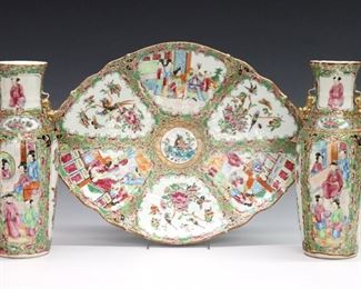 Three pieces of Chinese Rose Medallion porcelain.  Includes a pair of vases and a footed platter with polychrome vignette panels depicting alternating floral and Court scenes with Gilded detail.  Unmarked.  Some wear to decoration, one vase with glued repair to top half.  Up to 14 1/4" long and 10" high.  
