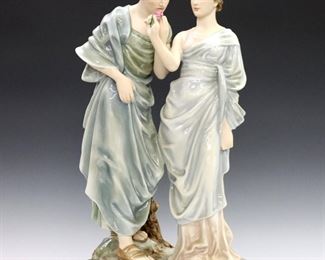 A mid 20th century Royal Dux porcelain figural grouping.  Depicts a pair of Roman lovers on a rocky outcrop with polychrome decoration.  Printed "Royal Dux" mark.  Very minor surface wear.  Approx. 11 x 6 x 20 1/2" high overall.  