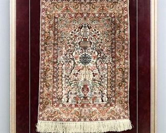 A framed 1.5' x 2' Turkish Ghiordes Silk prayer rug.  Multicolor floral and Tree of Life design on an Ivory field, 600 KPSI.  Minor wear and fading.  In a modern custom frame, 29 1/4 x 37 1/4" high overall.  
