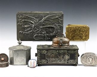 Eight 19th to mid 20th century metal boxes and cases.  Includes a Danish Cast Iron over wood casket, an Arts & Crafts Pewter over wood cigar box, a British Pewter tea caddy, a German engraved Brass cigarette case, a Silverplate snuff box, a Turkish copper plated cricket box, and others.  