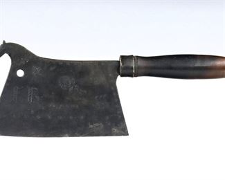 A 19th century Swiss "Metzger Meister" figural Iron cleaver.  Iron horse form cleaver with engraved detail and shaped wooden handle.  