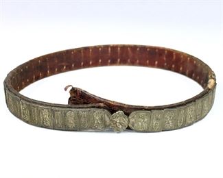 An early 19th century Ottoman Balkans leather belt.  Handmade leather belt decorated with silvered metal plaques and buckle with folkish floral designs.  Some wear and losses.  