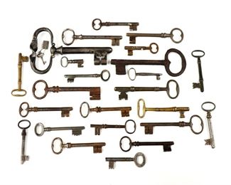 A collection of vintage and antique keys.  Includes approx. twenty-two keys and one key form corkscrew.  Various degrees of wear.