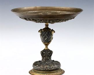 A 19th century French Grand Tour Bronze tazza.  Neoclassical design with Greco-Roman scenes on a baluster stem with ram's head detail and patinated finish.  