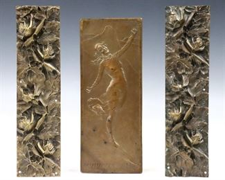 Three early 20th century Bronze plaques.  Includes a commemorative Bronze plaque depicting a woman skiing by Percival Hedley (British, 1870-1932), and a pair of architectural plaques depicting roses in high relief.  Commemorative plaque incised "P. Hedley", numbered "DCCCLIX" (859) and dated "MCMXIV" (1914) lower left.