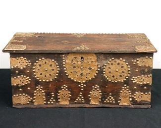 A 19th century Indo Persian ship's chest.  Rosewood construction with etched Copper flashed mounts, side handles and nail head decoration.  Hinged top opens to reveal two fitted compartments above an open storage well. 