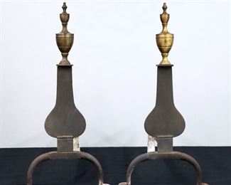 A pair of late 18th century American Federal Period Knife Blade Iron andirons.  Brass urn form finials over Cast Iron stems and hammered Iron bars with arched legs and pad feet. 