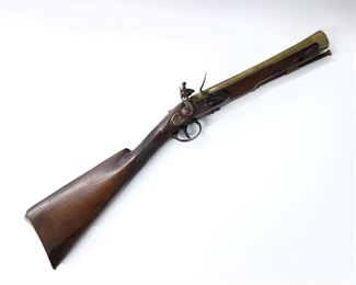 A "Fantasy" French Flintlock Blunderbuss.  12 1/2" Brass barrel with 1 1/2" muzzle, checkered Walnut stock, and Brass trigger guard and butt plate.  Touchmarks at barrel.  Decorative with various assembled parts, wear to patina and some pitting.  28 1/2" long overall.  ESTIMATE $200-400